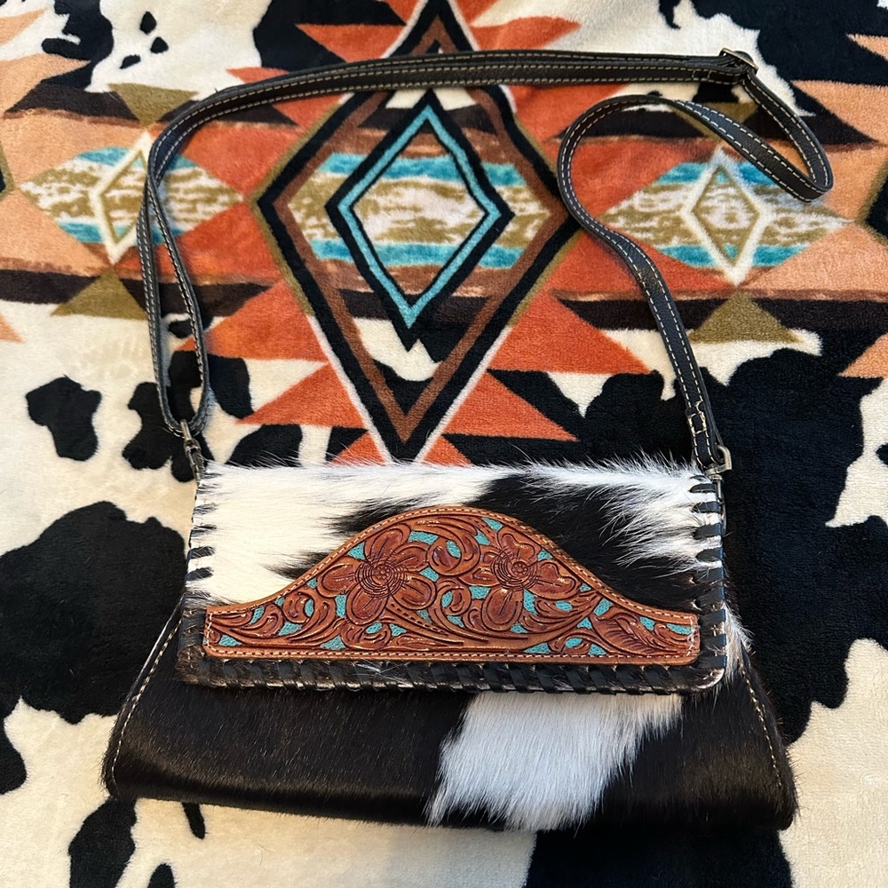 Tooled leather and cowhide clutch purse